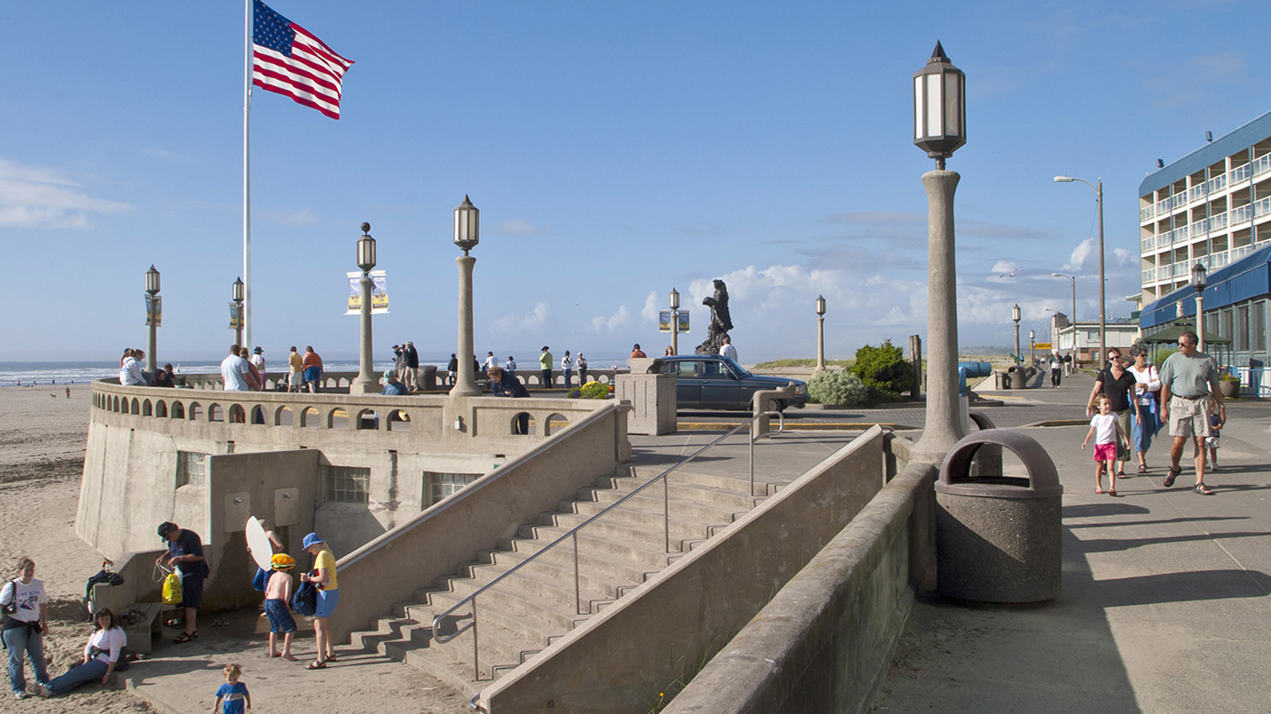 An American flag flies above the Seaside turnaround and the sandy beach.
