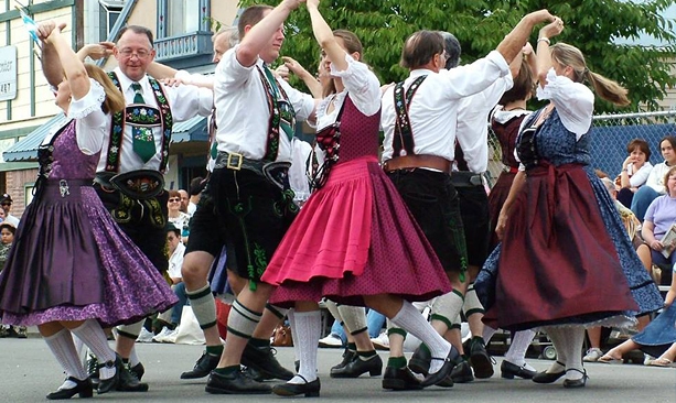 Wearing traditional Bavarian attire, dancers are seen in mid-swing at the Oktoberfest celebrations in Mt. Angel.