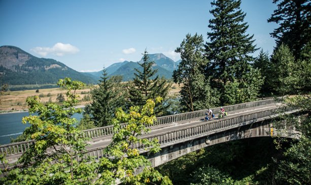 There are miles-long cycling paths along the Historic Columbia River Highway that are car-free. (Photo credit: Russ Roca)