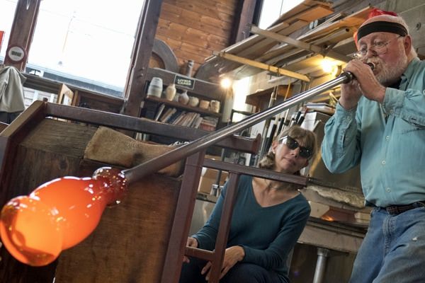 Glassblowing artist Jim Kingwell works shapes a piece during Stormy Weather Arts Festival.