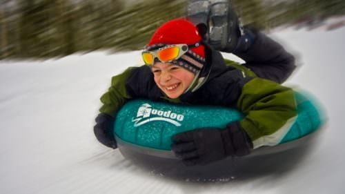 Kid smiling on Hoodoo tube