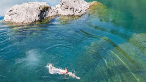 Take a dip in the crystal-clear Chetco River at a spot called Elephant Rock, not far from Brookings Harbor on Oregon's South Coast. Always remember to leave no trace and follow safety guidelines when visiting all swimming holes. (Photo by Mike Battey)