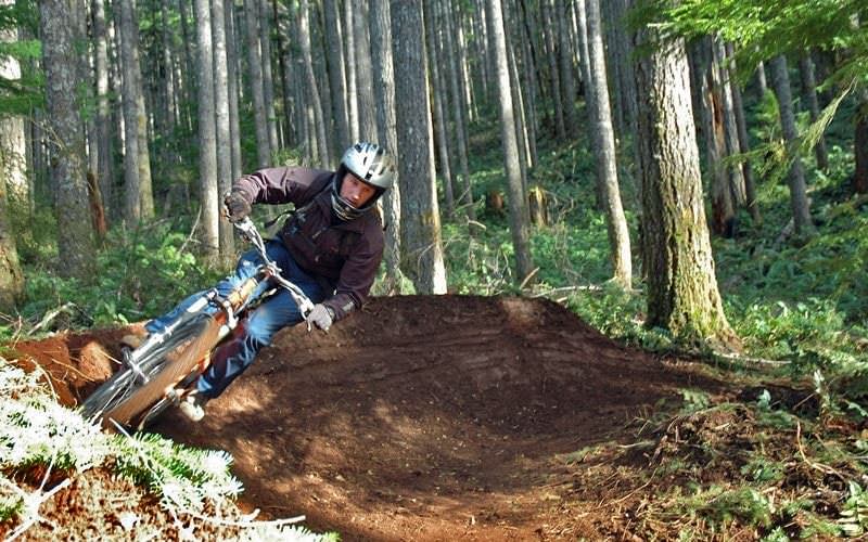 Mountain biker slides up a hill at Black Rock.
