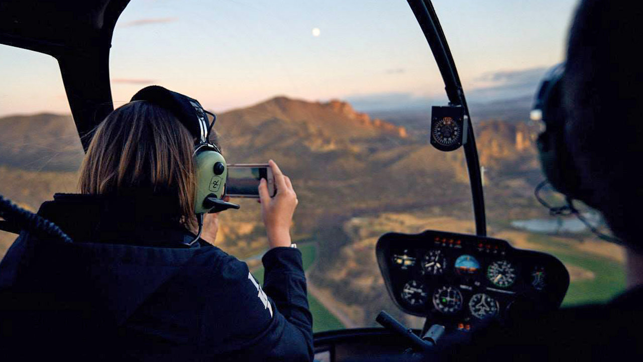 A helicopter passenger takes a photo over Smith Rock.