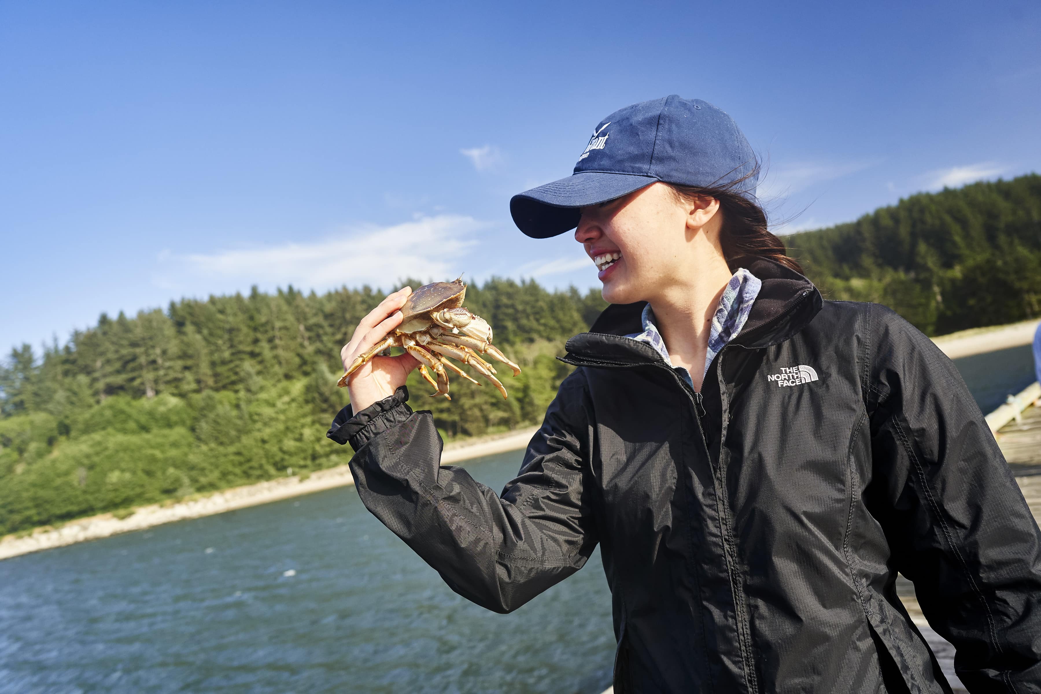 Female holding a crab in Coos Bay