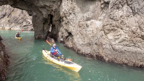 Person kayaking on the southern coast