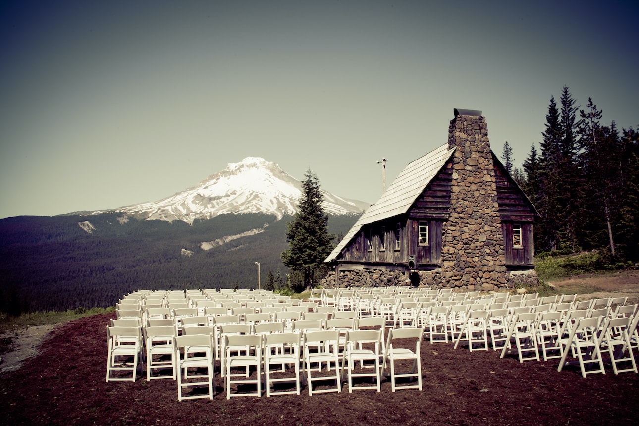 Chairs are set up at a ceremony site with Mt. Hood's peak in the background.