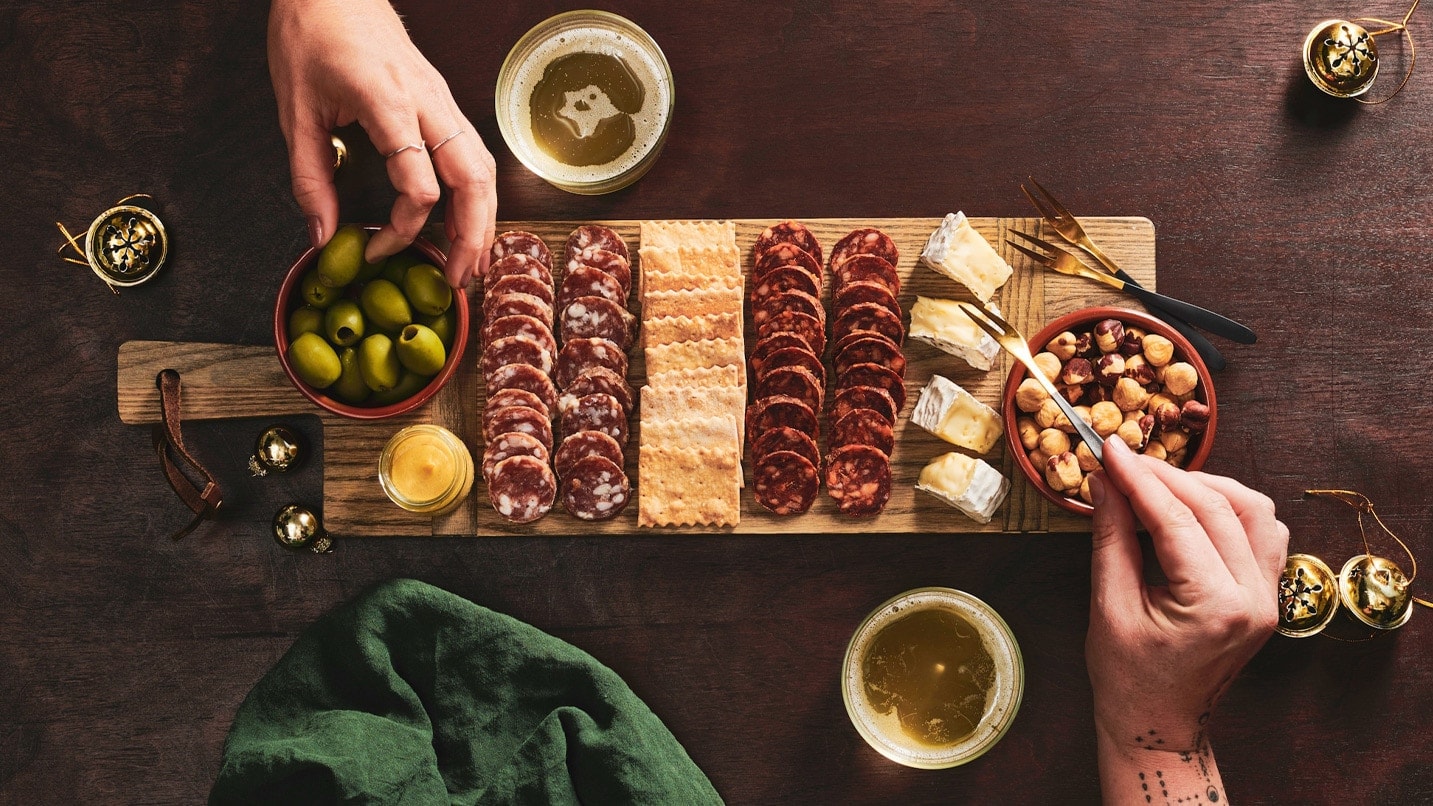 A selection of meet and cheese on a board