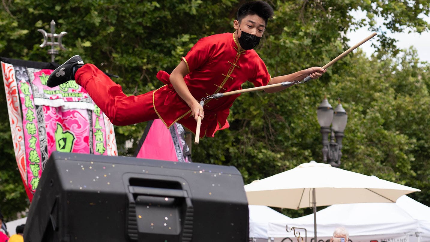 A performer appears to hover in mid-air