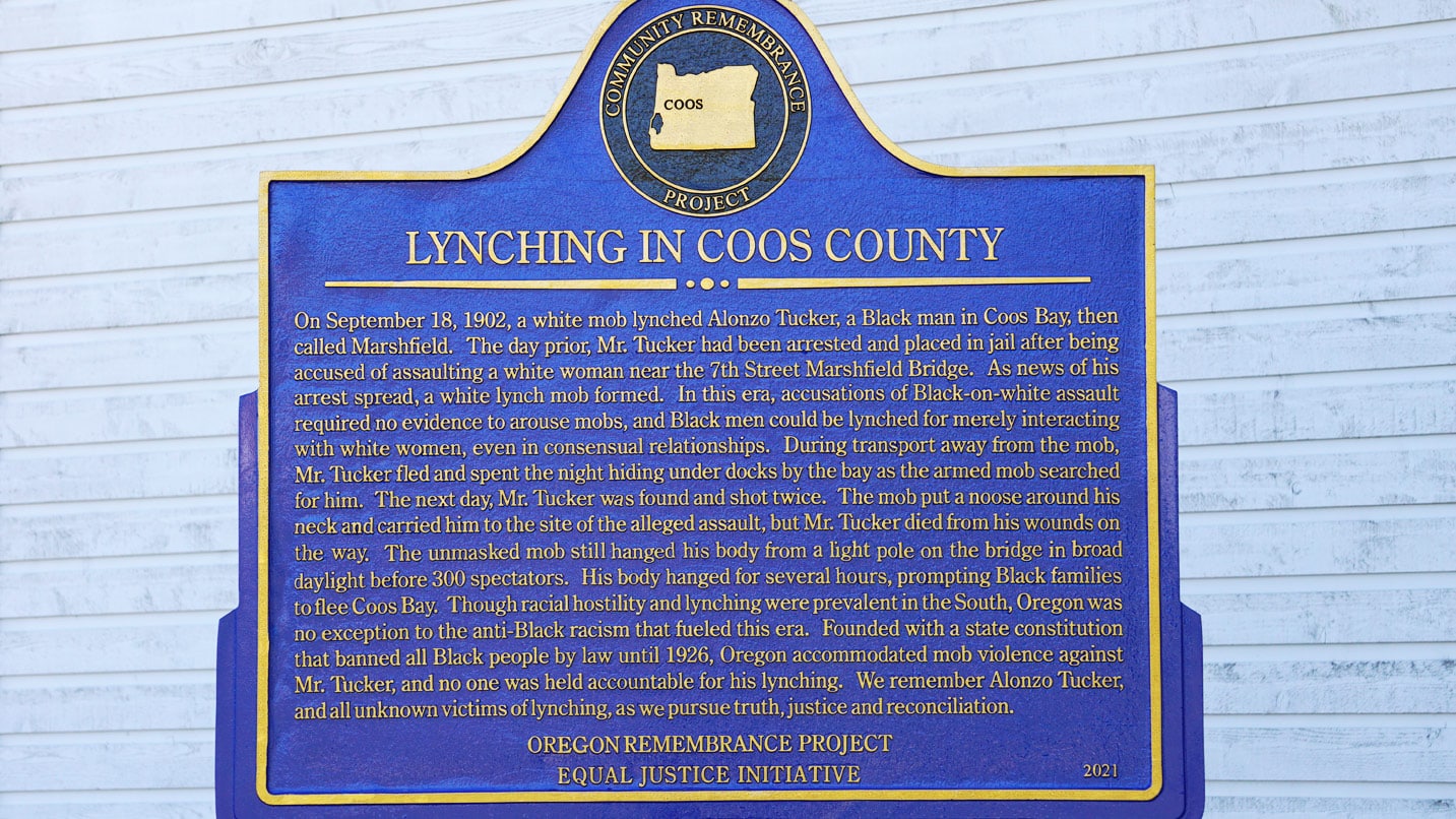 A plaque acknowledging a lynching in Coos County in 1902