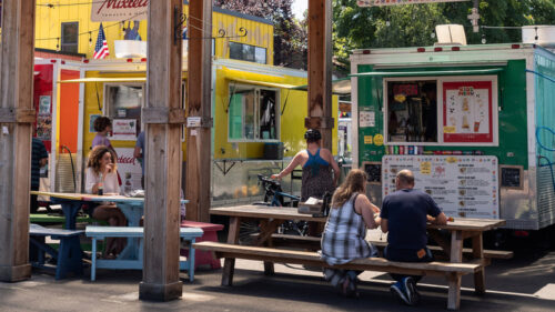 A line of brightly colored food carts