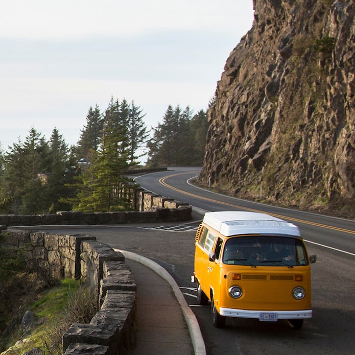 Yellow van driving along coastal highway 101