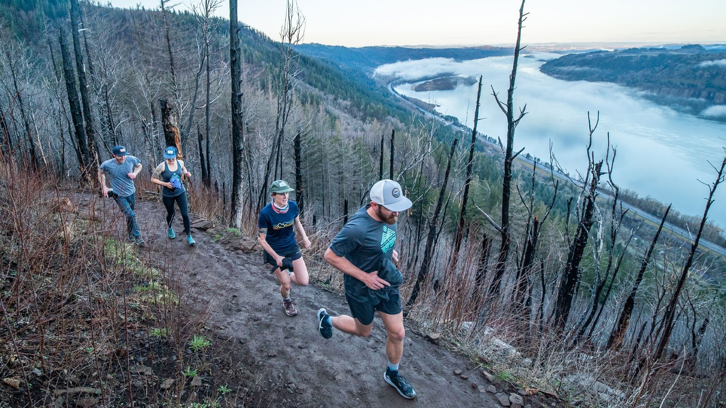 Group running along single track trail in the Gorge.