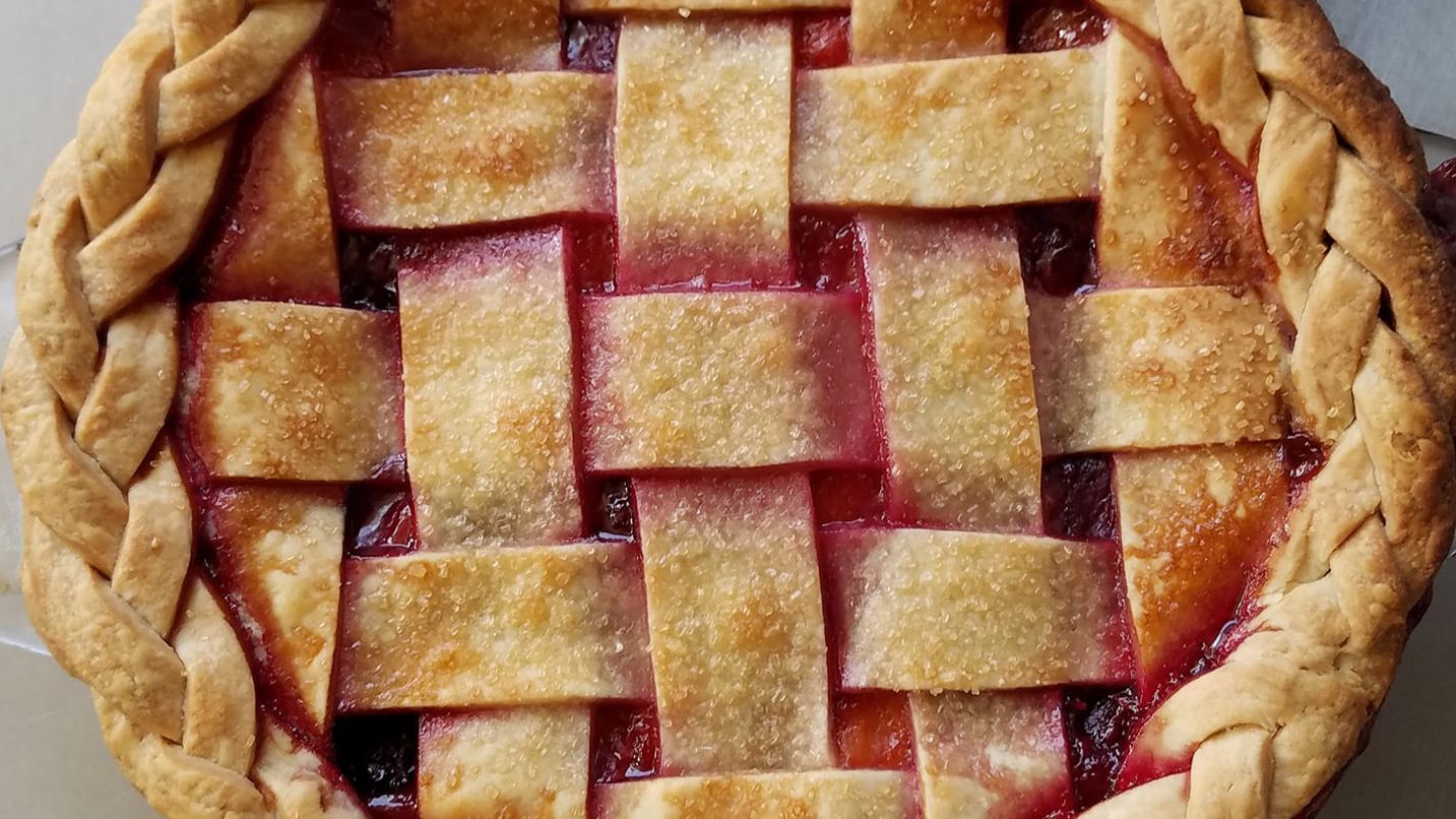 lattice pie crust with berry filling inside