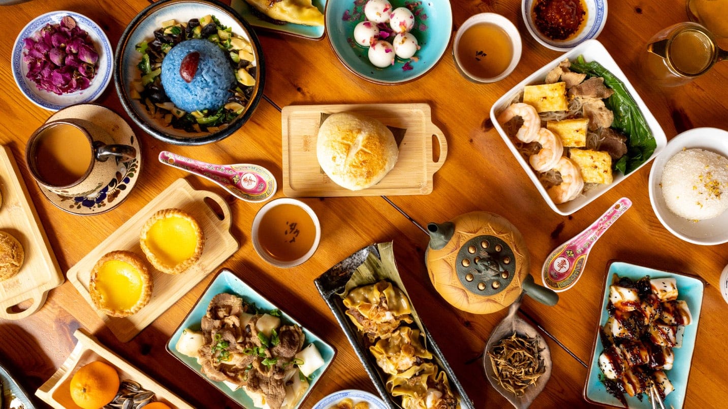 Overhead view of plates of food and tea on a table