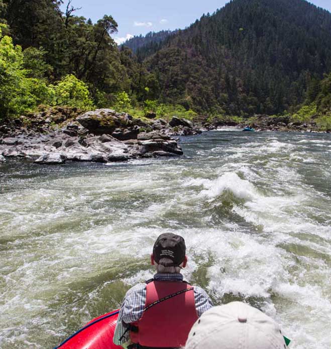 A man rafting the rapids of the Rogue River