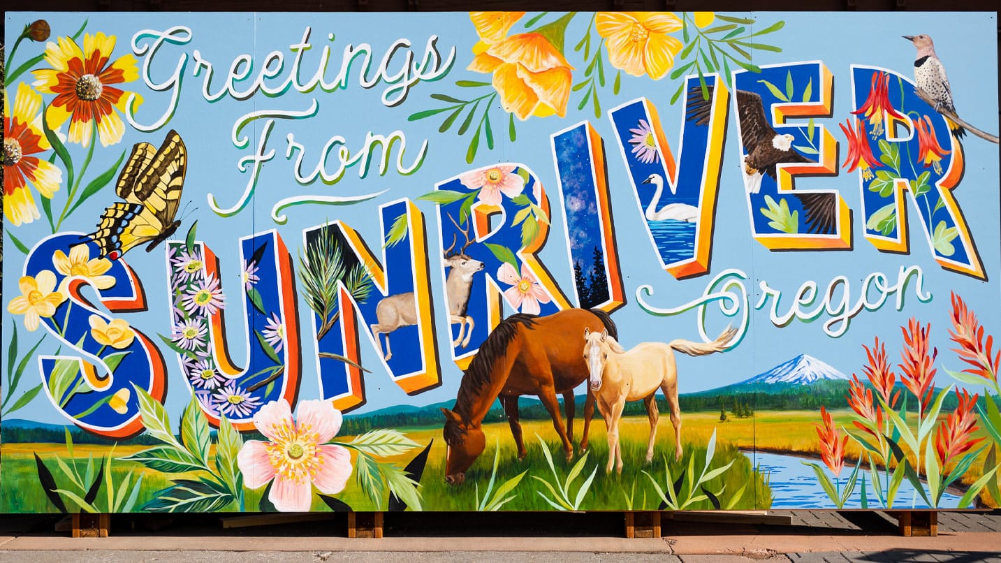 A colorful mural says "Greetings from Sunriver, Oregon"