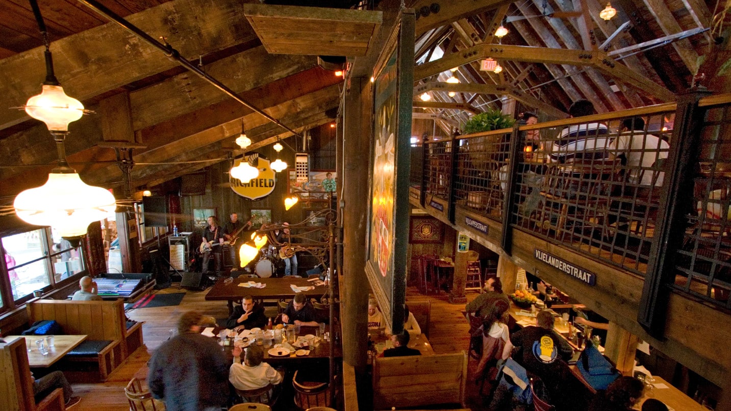 Interior shot of a wood-paneled restaurant seating area.