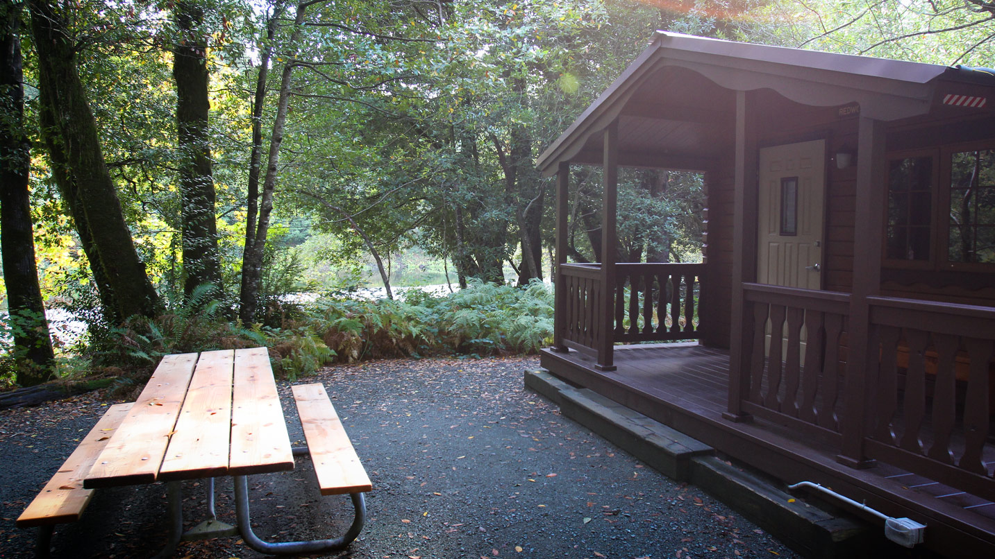A cabin and picnic table.