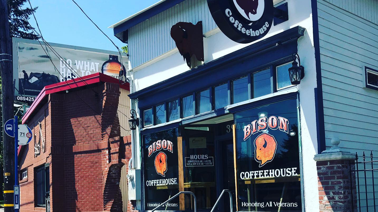 Exterior of Bison coffeehouse. Small shop, logo features a print of a bison head.