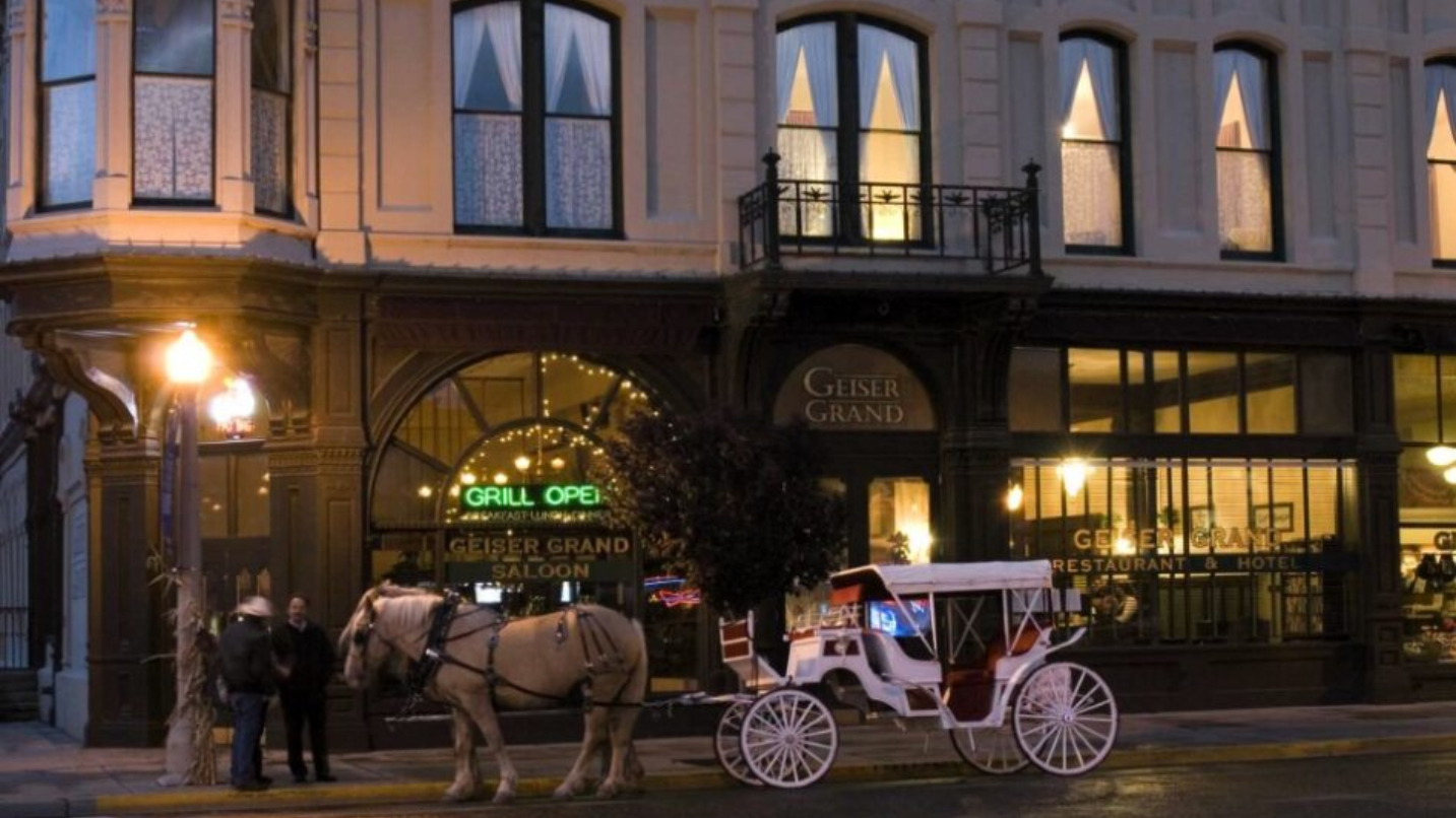 Horse-drawn carriage outside a historic hotel