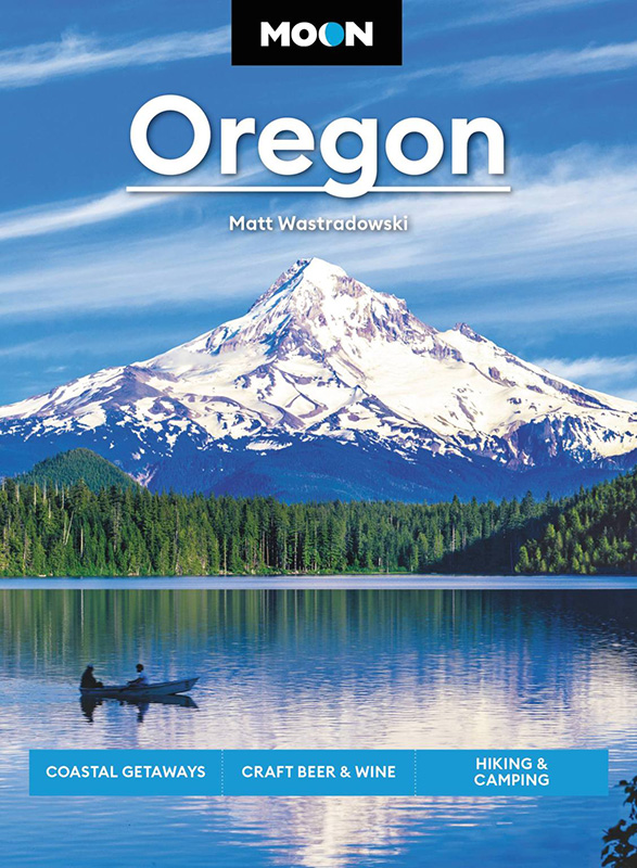 Cover of a travel book by Matt Wastradowski featuring a lake and mountain.