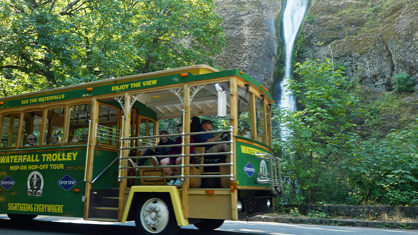A trolley takes guests close to Multnomah Falls