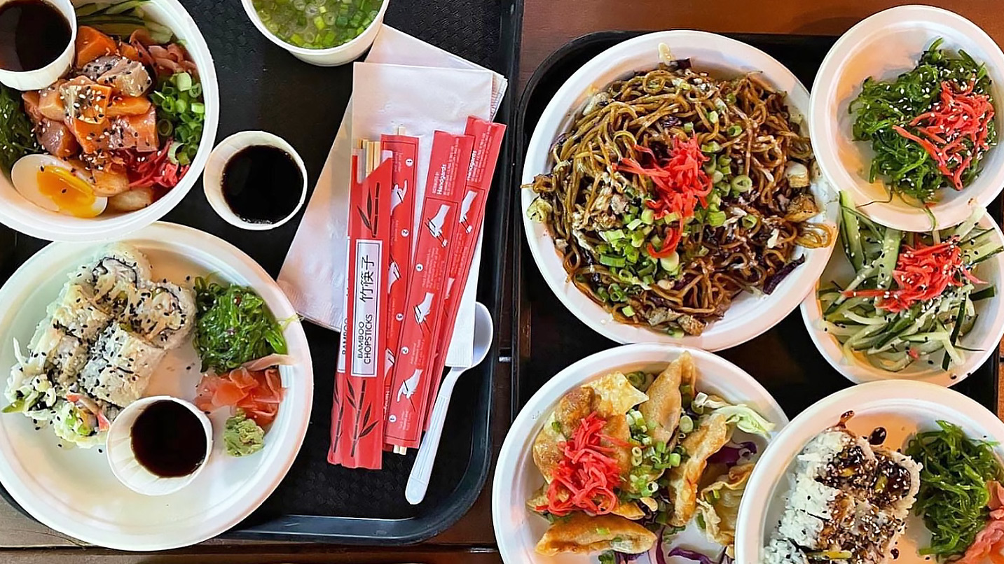 Overhead view of plates of Asian cuisine from Koya Kitchen.
