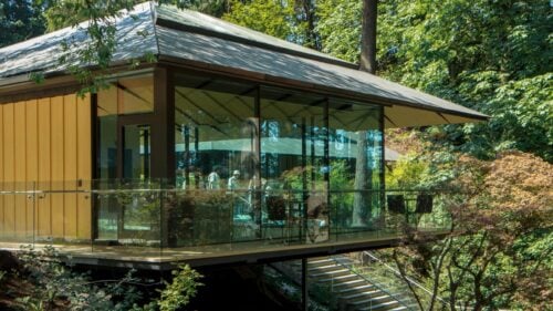 View of exterior of Umami Cafe surrounded by trees at the Portland Japanese Garden.
