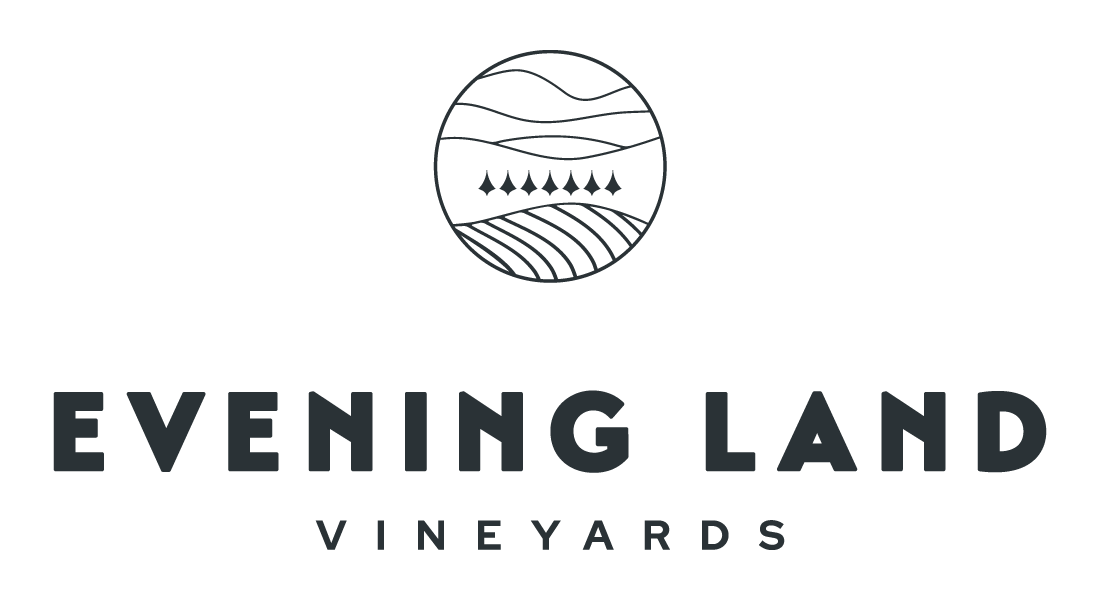 Logo featuring a circular emblem depicting stylized hills, trees, and fields. Below, bold text reads: "EVENING LAND VINEYARDS." The background is plain.