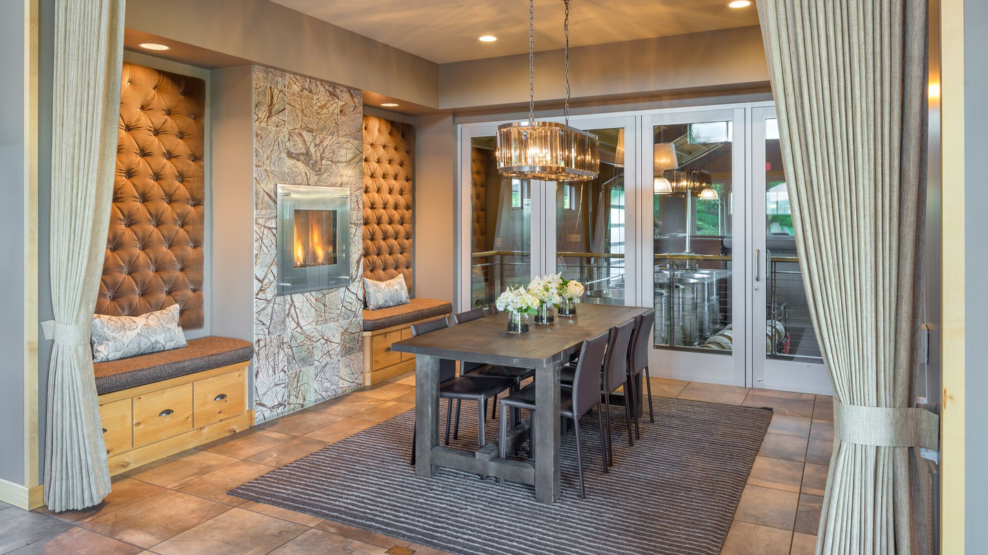 A wine tasting room with a fireplace.