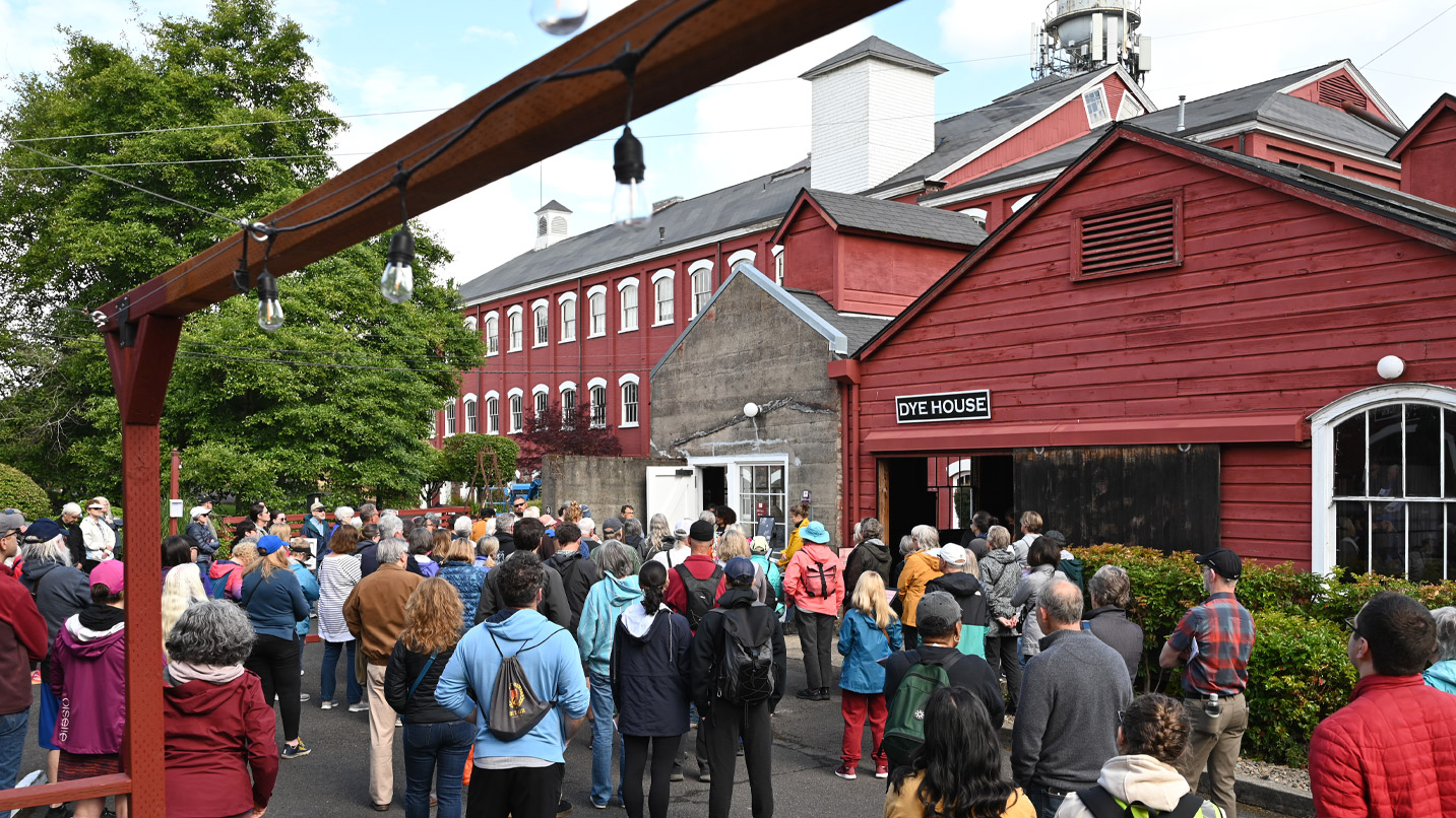 Large group of people outside a museum during a walking tour.