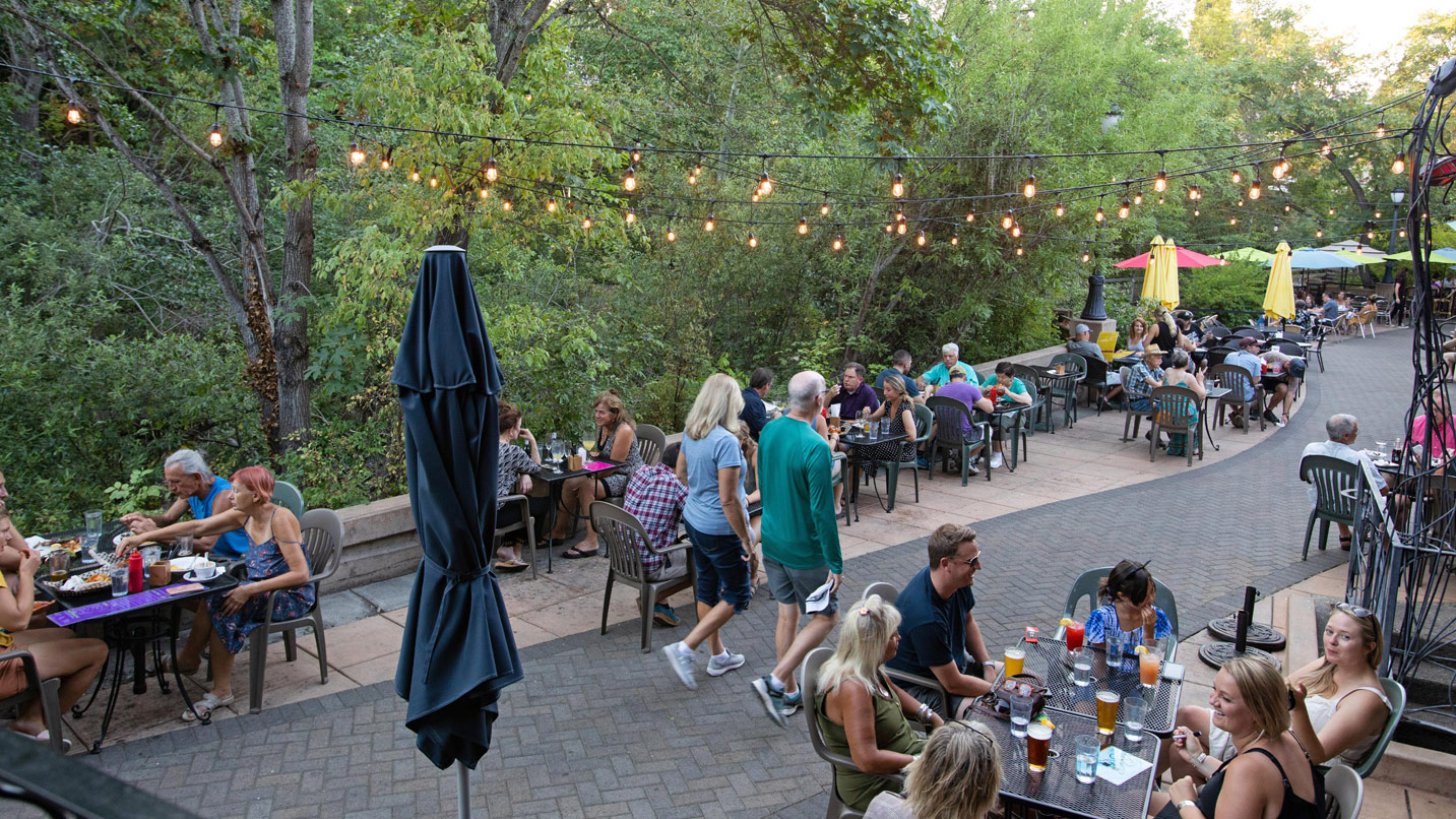 Creekside dining near Lithia Park on a busy day.