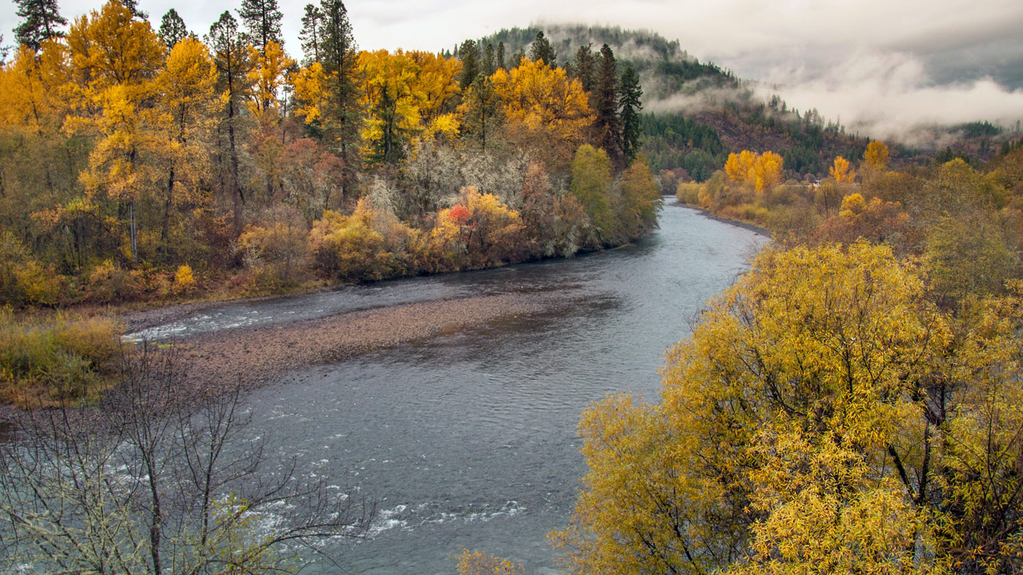 A view of the Santiam River and the surrounding fall foliage.