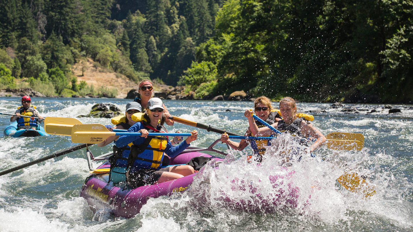 A large group whitewater rafting.