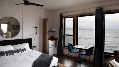 A hotel room overlooking a river.