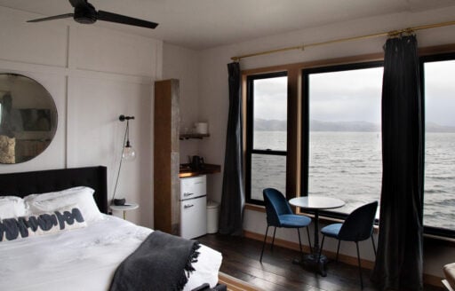 A hotel room overlooking a river.