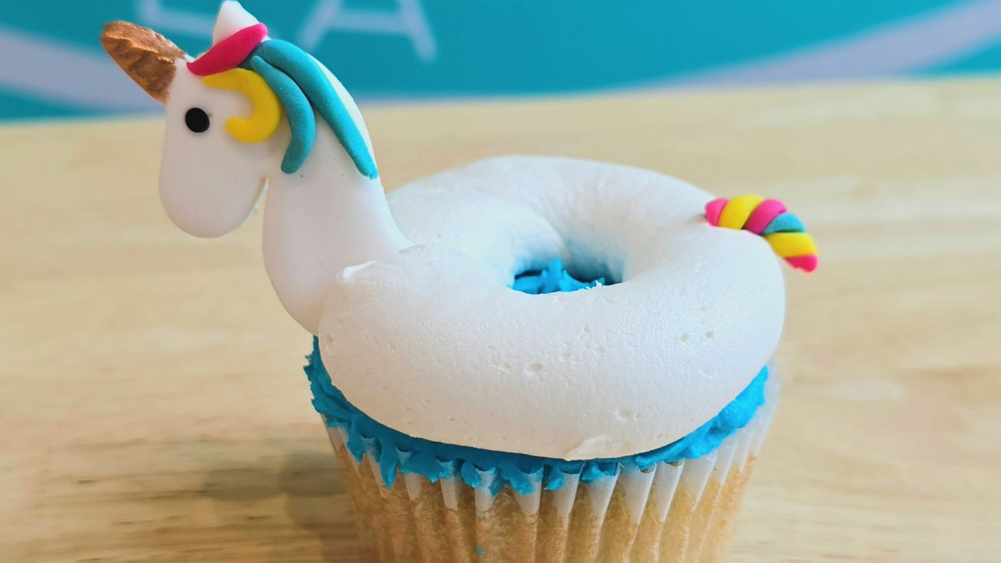 A unicorn-themed cupcake.