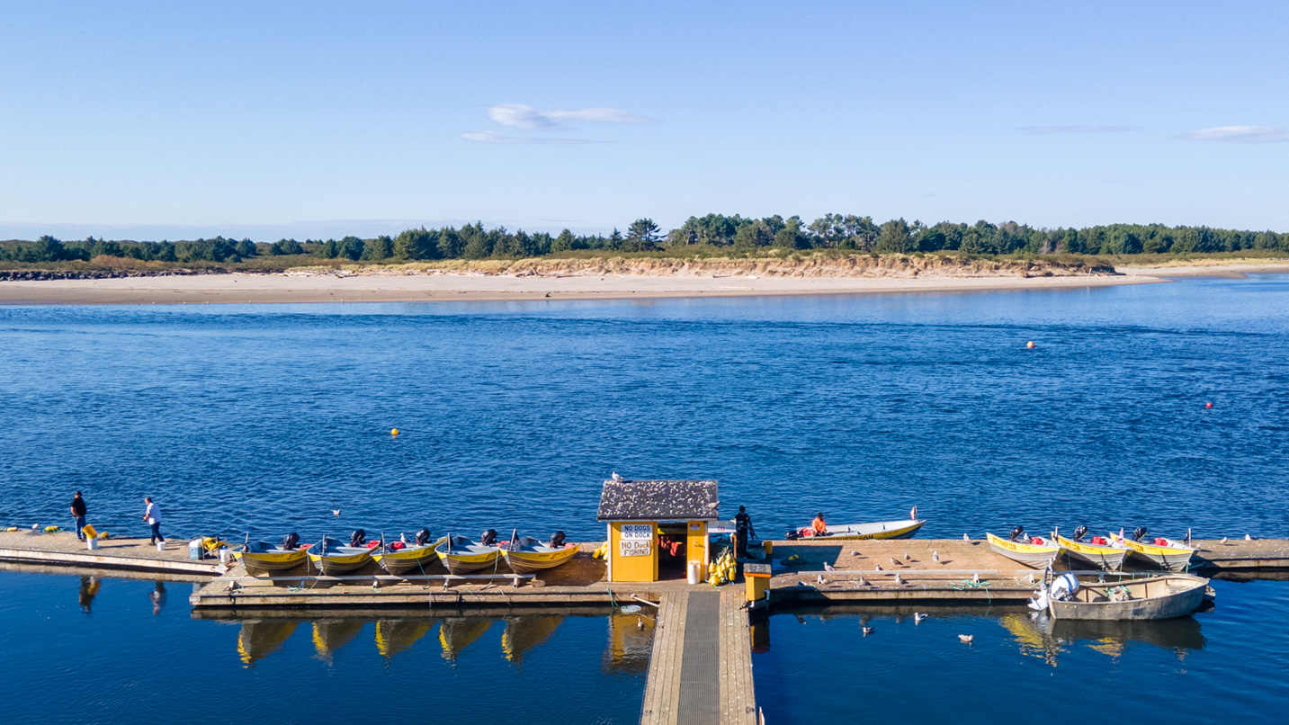 A marine dock on a calm bay.
