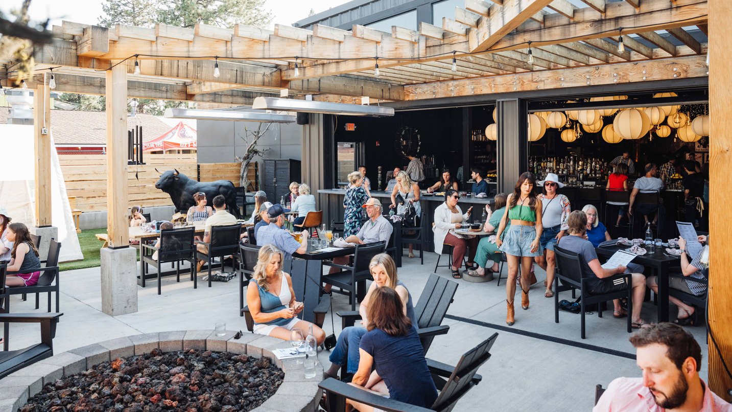 People dine on an outdoor patio.