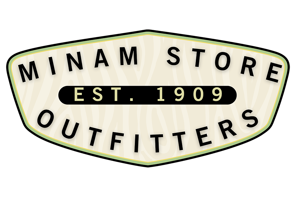 A vintage-style emblem features bold text: "MINAM STORE OUTFITTERS," with "EST. 1909" centered, against a wood-grain patterned background, creating an outdoorsy brand aesthetic.