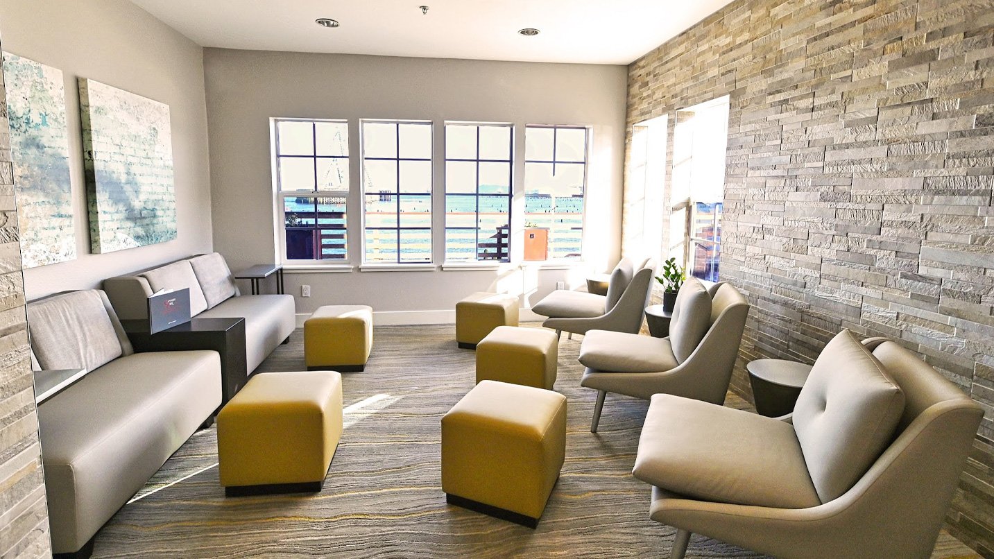 A cozy lounge room with a view of the river.
