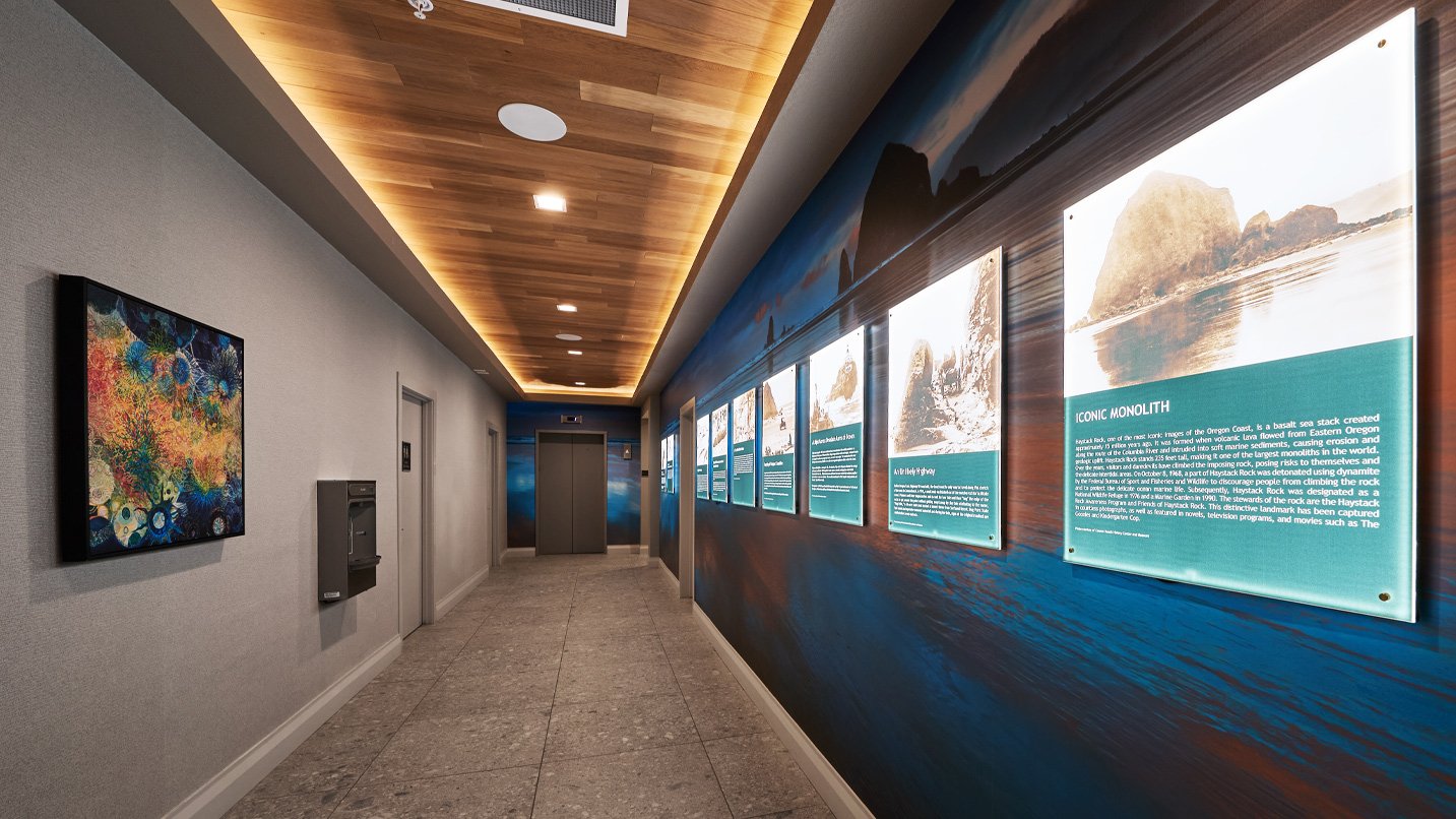 A hallway lined with informational photos.