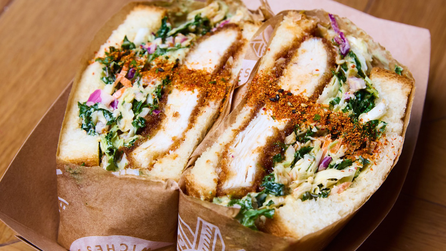 A cross-section of a Japanese pork and slaw sandwich.