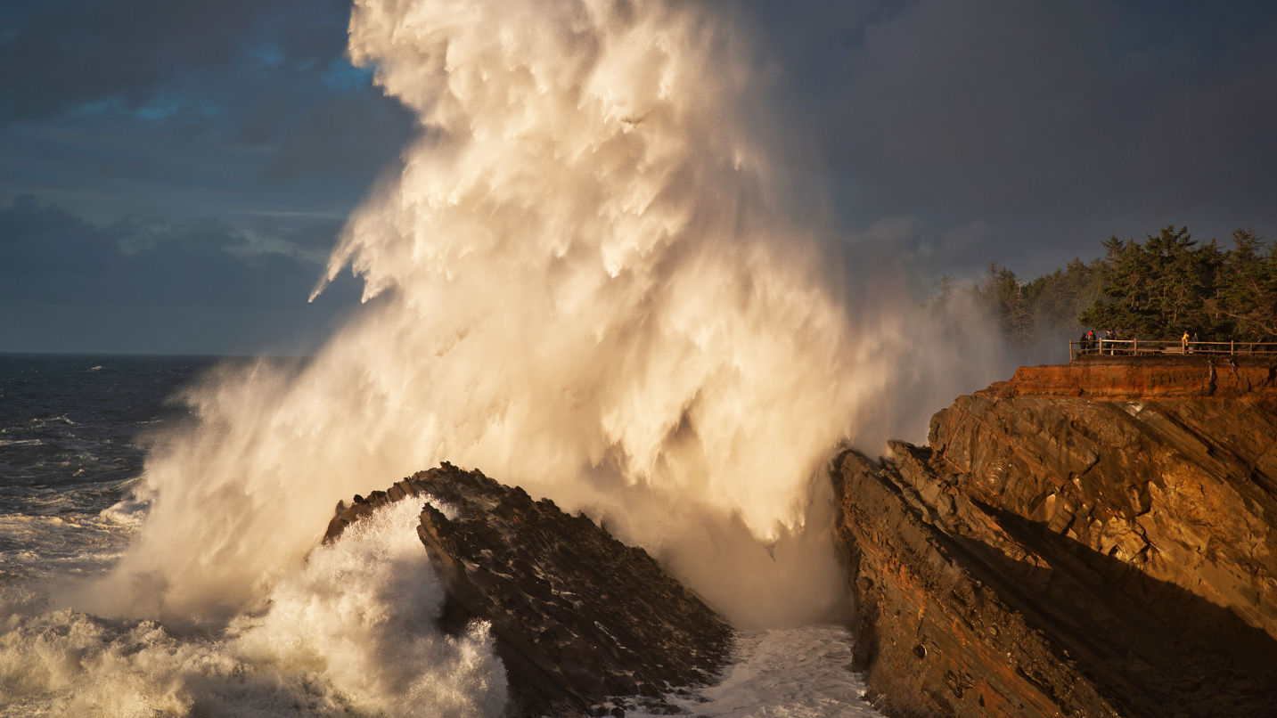 A large wave crashed into a cliff.