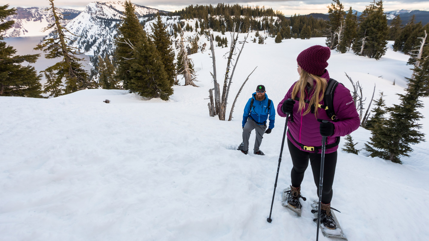 People walking across snow.