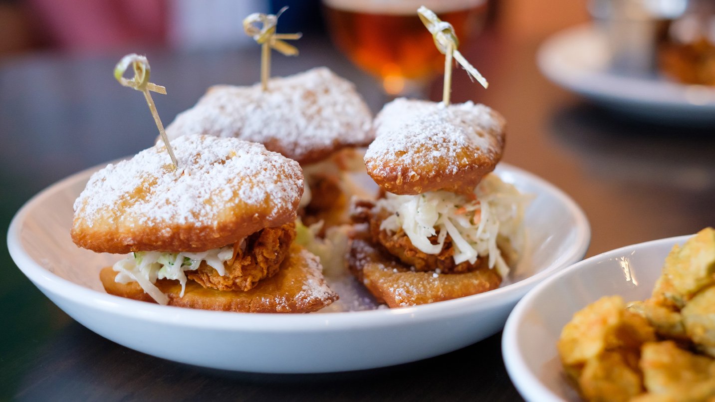 A plate of small sandwiches.
