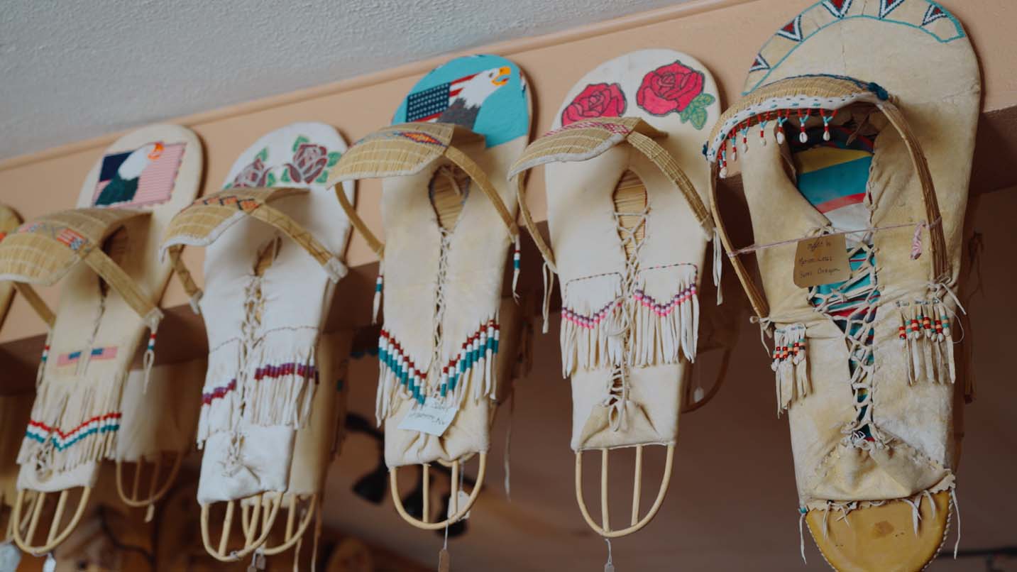 Colorful tribal-made moccasins on display.