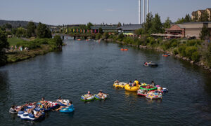 People float down the river on innertubes in Bend.