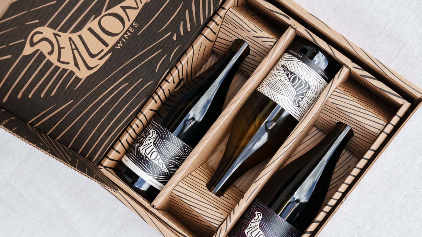 A box of three wine bottles.